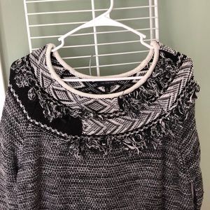Black and white sweater with fringed neckline